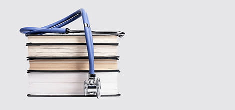 Medical textbooks and stethoscope